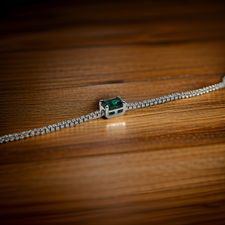 Tennis bracelet with green stone